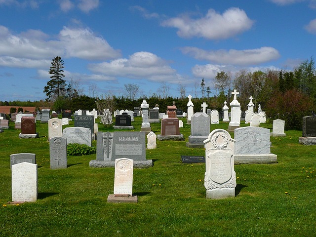 Gravestone in a historic cemetery with visible inscriptions.